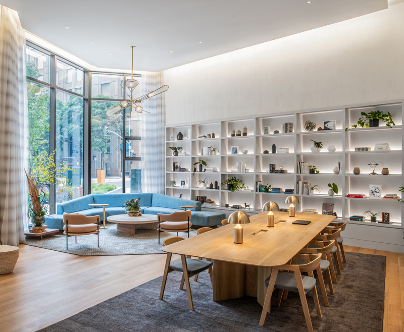 Crisp and airy MIRA foyer with LED illuminated shelving