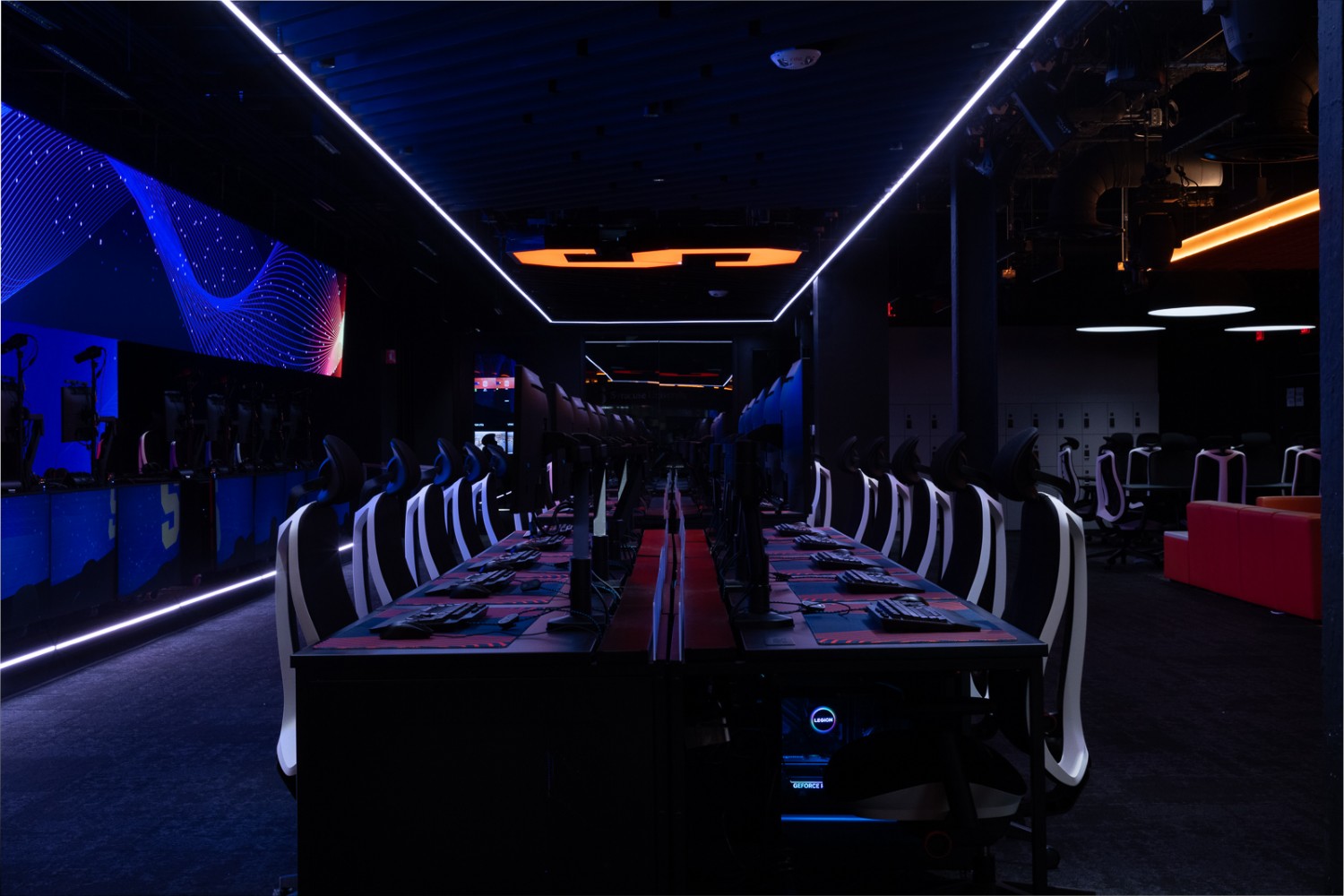 Syracuse University esports room featuring custom ceiling luminaires and tuned gaming lights by QTL.