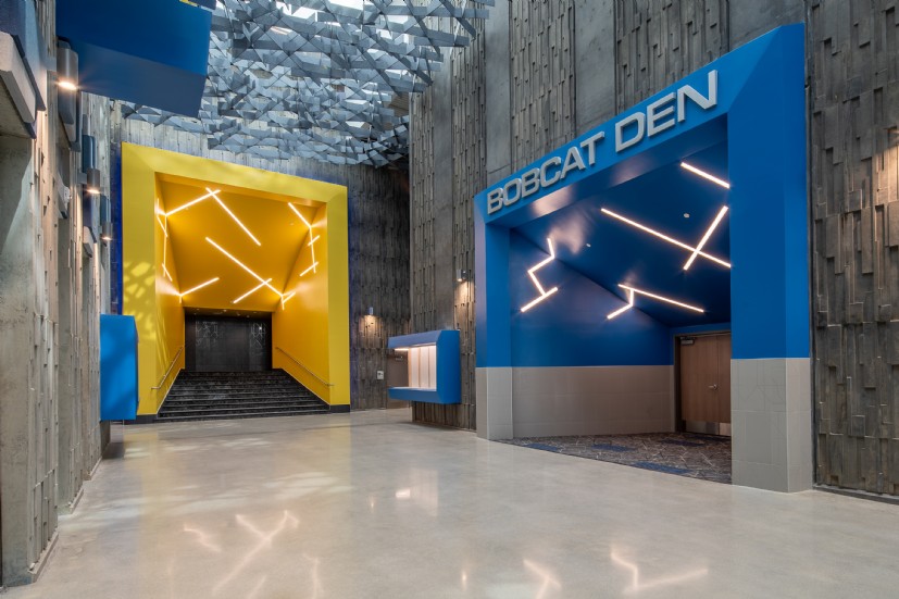 Modern LED corridor lighting in Union Middle School common areas designed by QTL for high performance