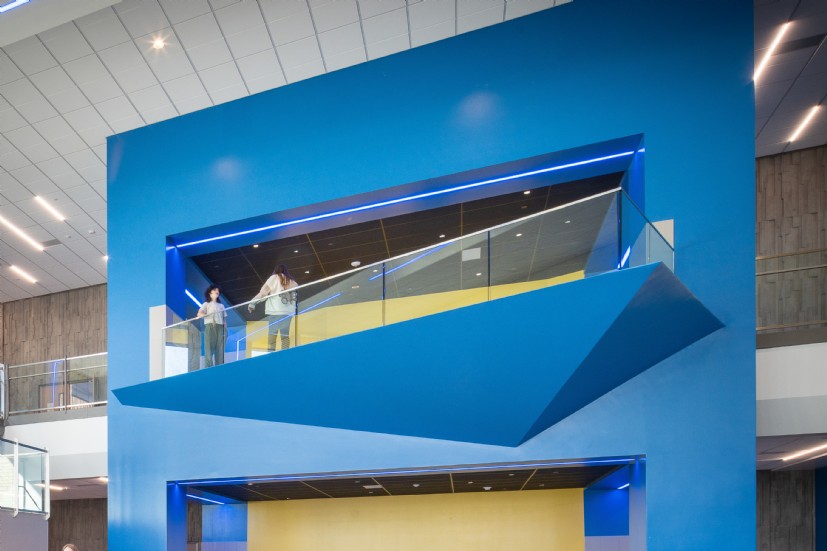 Rear view of Union Middle School cafeteria showcasing QTL’s LED school cafeteria lighting system and architectural execution