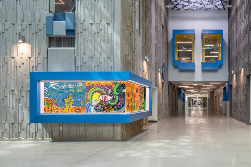 Union Middle School common area lighting by QTL highlights hallway architecture with precision LED design