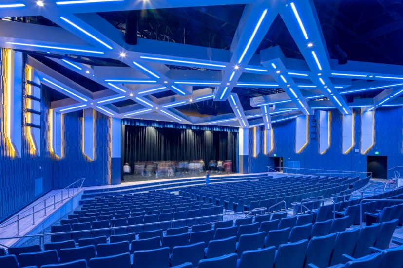 Union School auditorium lighting by QTL featuring linear LED fixtures and architectural design