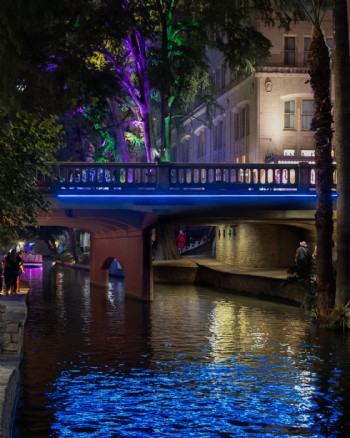 “Exterior pedestrian walkway lighting by QTL transforms San Antonio River Walk into welcoming evening destination