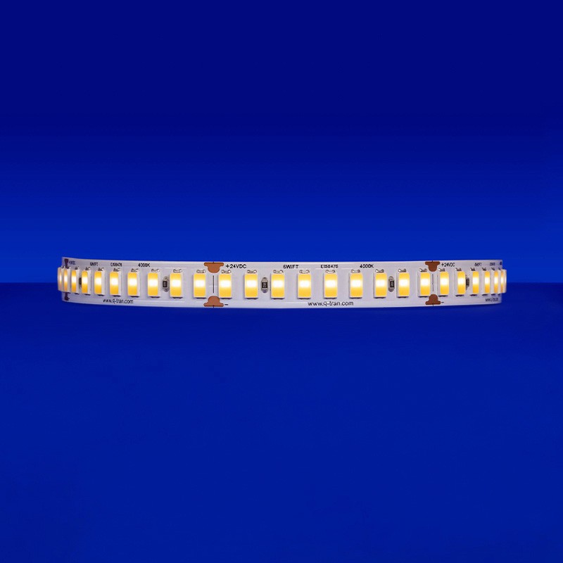 Close-up of the SW-HE+24/6.0 LED strip, emitting a warm 3000K light at 1085 lm/ft, highlighting its 9 diodes within every 2-inch segment